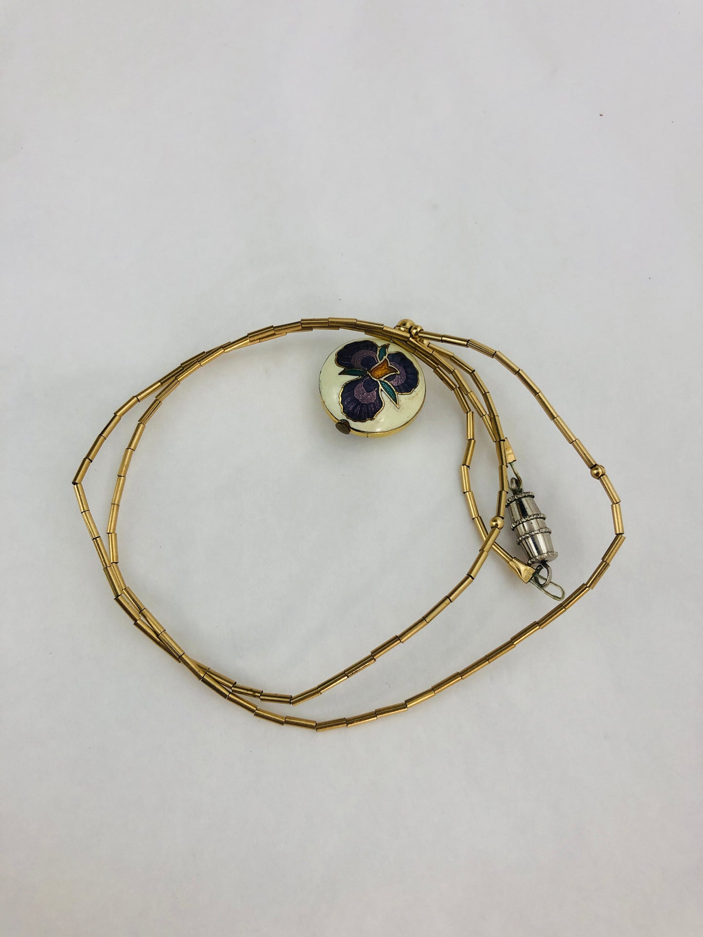 
                  
                    Rolled Gold Tube Necklace with Pendent (21598)
                  
                